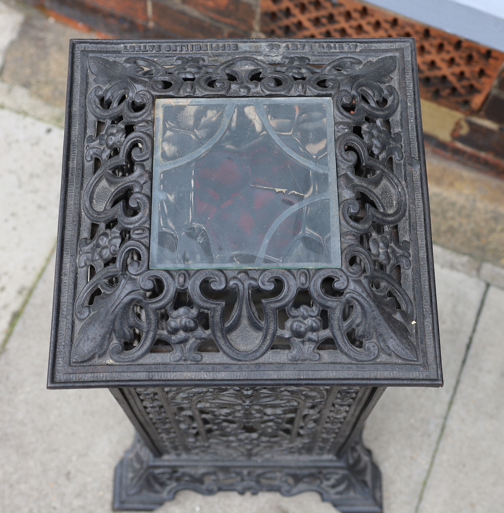 A Victorian cast iron conservatory heater, with the later glazed top, height 61cm. width 36cm